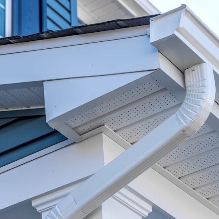 Downspout installed by a St. Louis gutter company carrying roof water away from the foundation