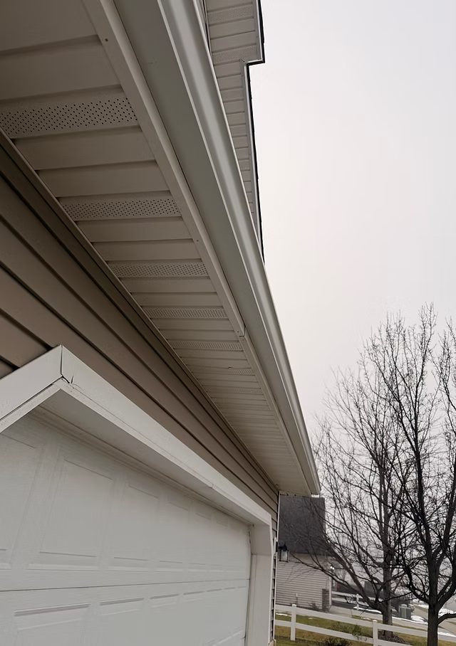 Seamless white gutters installed on a St. Louis home by a local gutter company